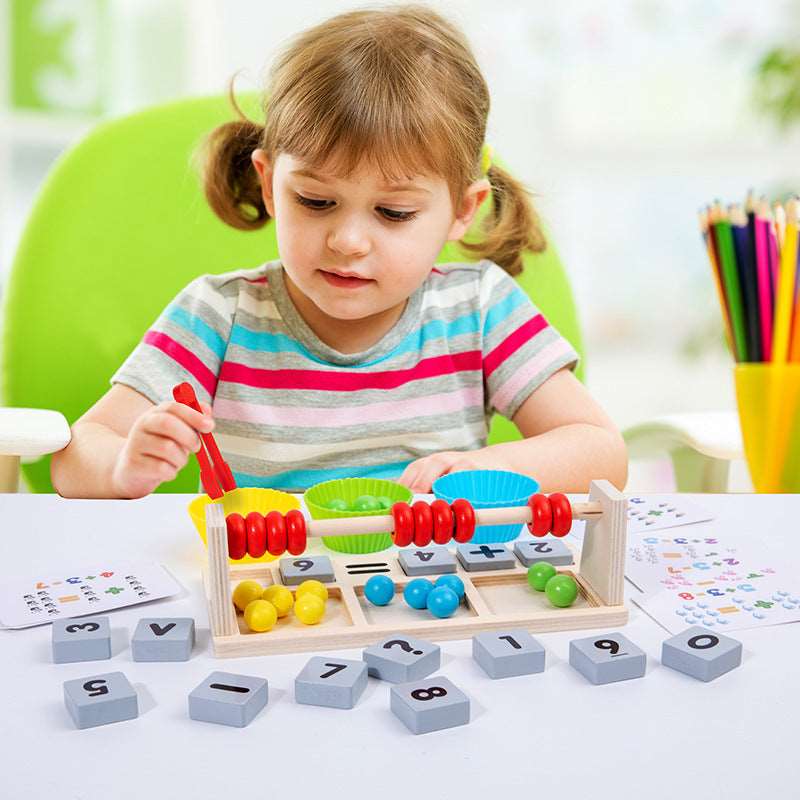 Child playing with educational abacus and math blocks at a table.