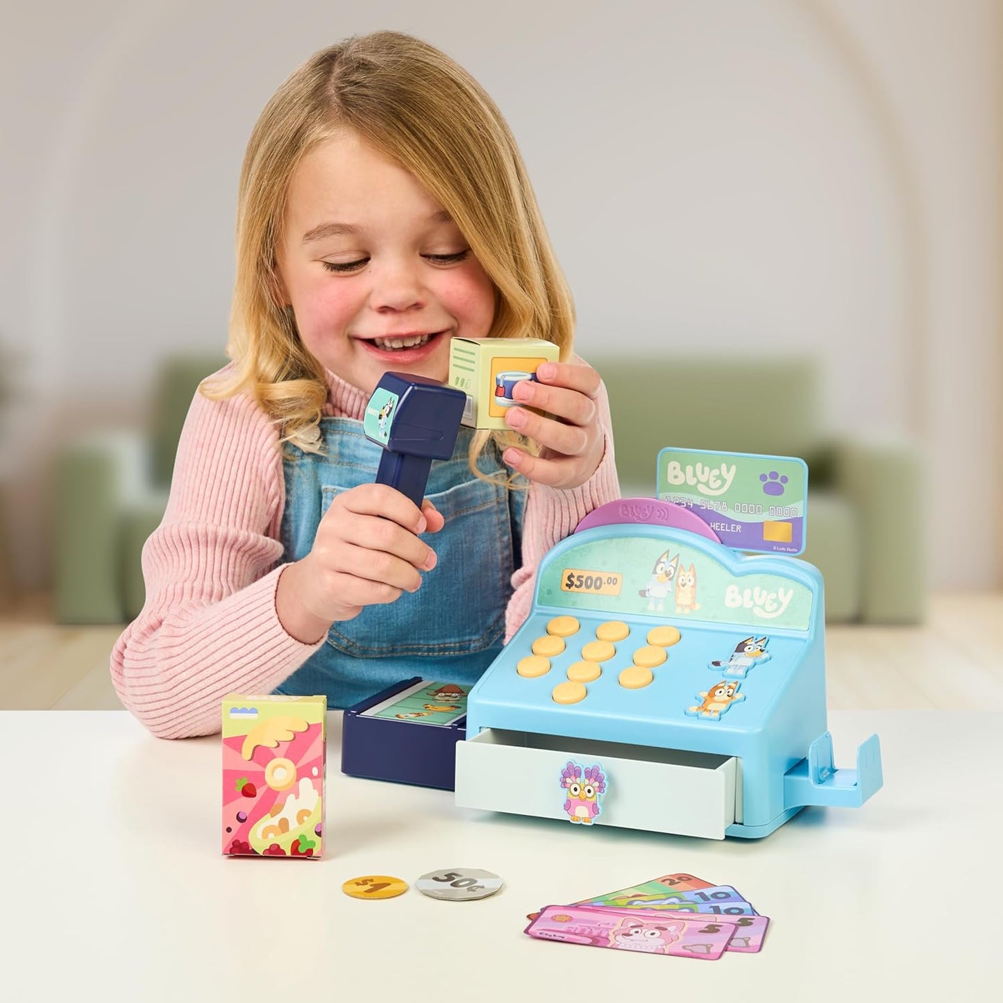 Bluey Cash Register. Press The Buttons to Hear Beeps, Sounds and Phrases from Bluey and Bingo |Use The Scanner to Scan Packages and Pretend to Run a Shop | Includes Toy Credit Card and Dollar Bucks!