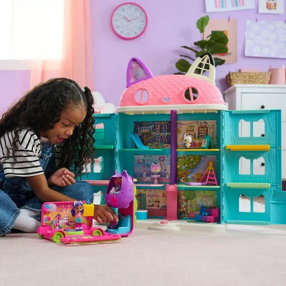 Gabby's Dollhouse Party Bus toy set in use with full dollhouse playset, showing interactive DJ mode and dance floor for dolls and accessories.